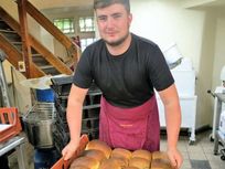 Callum packing loaves